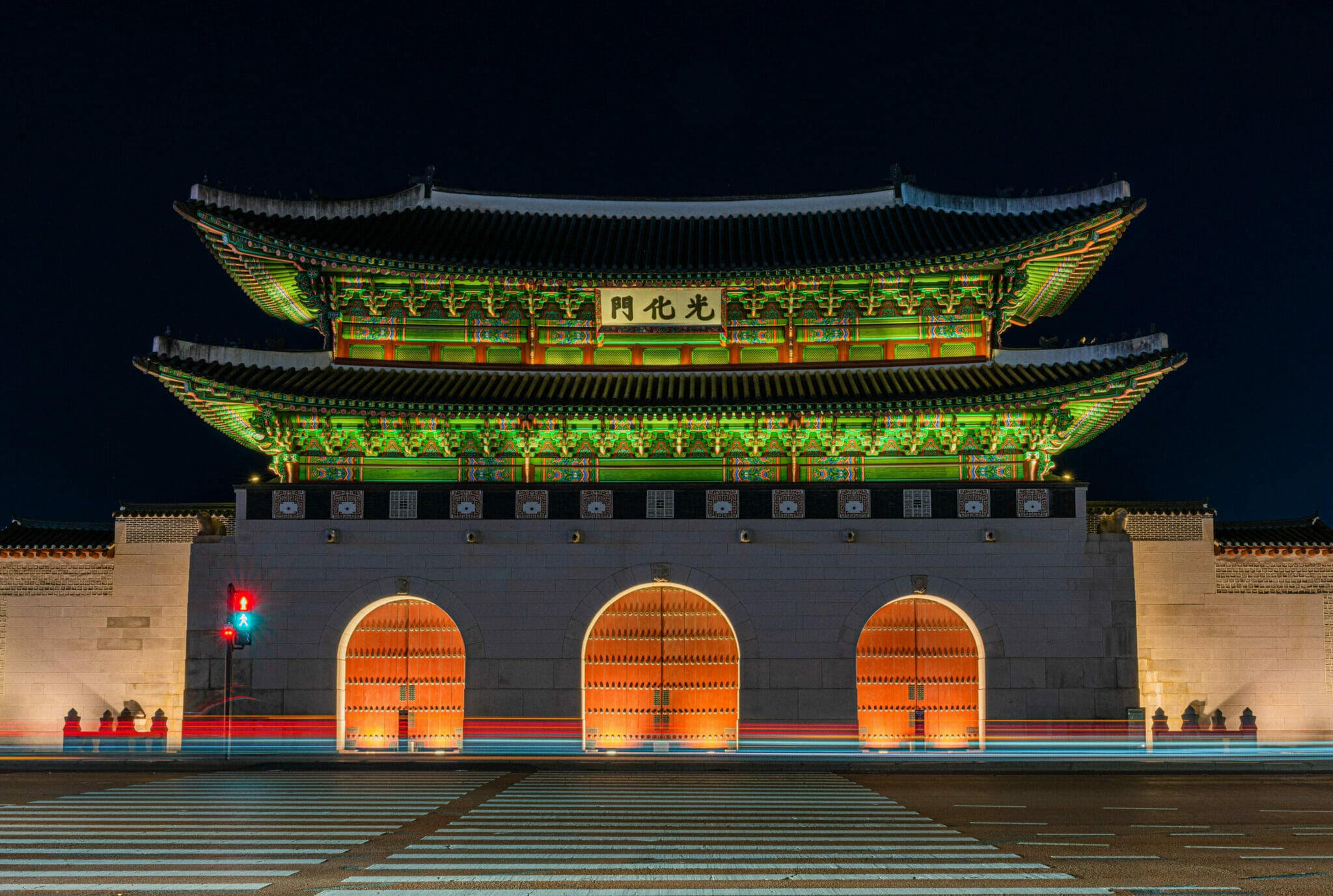 Gyeongbokgung Palace in Seoul with traditional painted eaves at golden hour